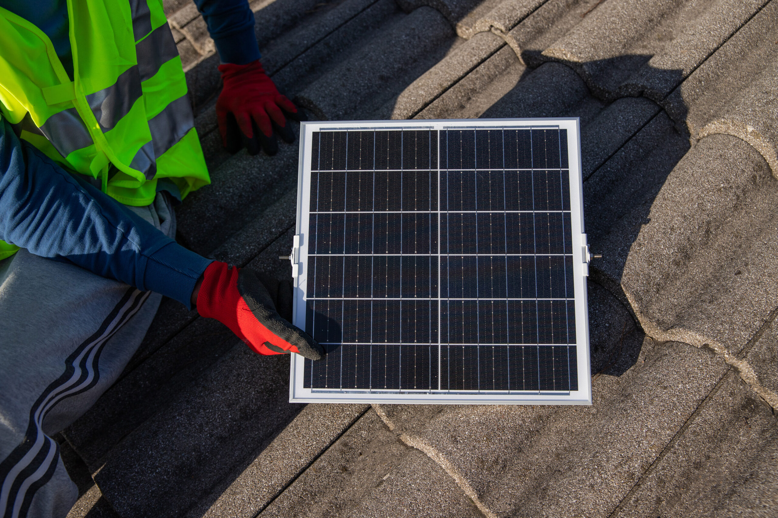 a technician installs a photovoltaic solar panel o 2023 02 14 18 12 51 utc scaled